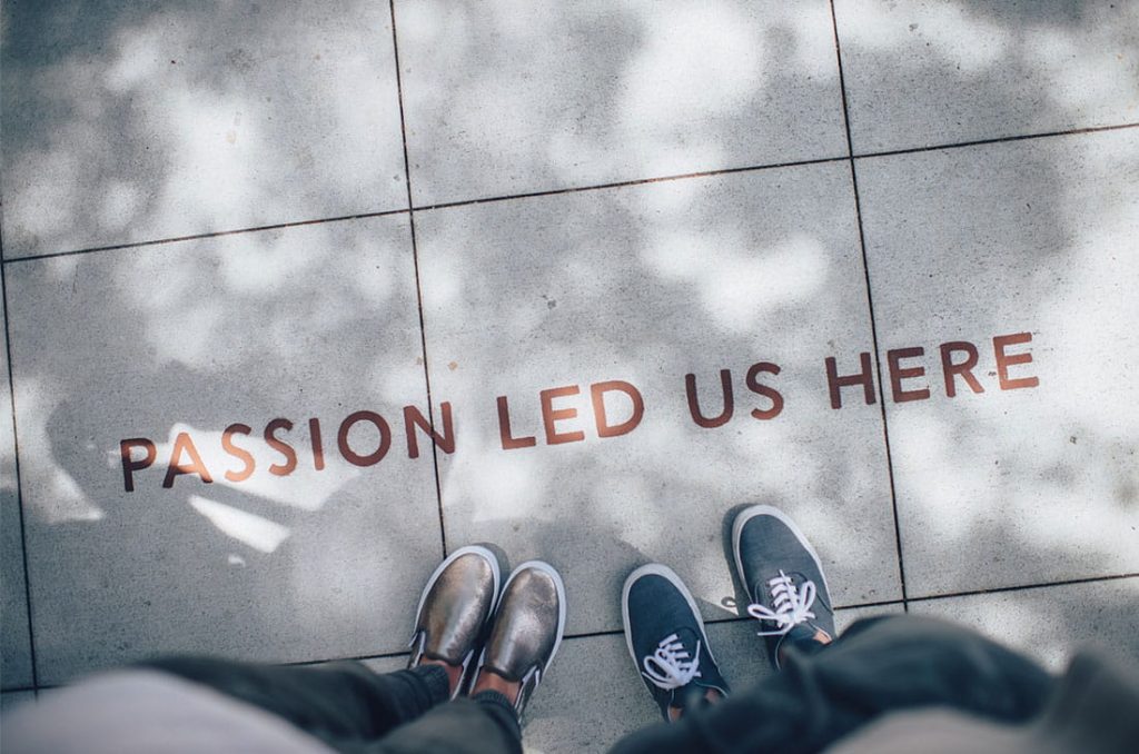 It says PASSION LED US HERE on the ground